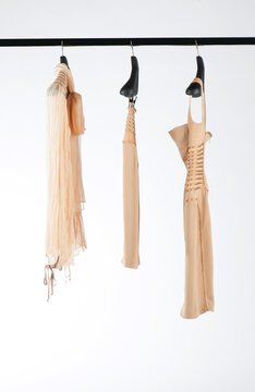 Elegant and trendy women's clothes hanging
