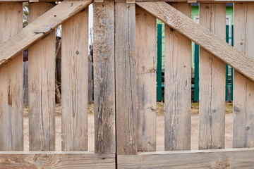 Wooden fence made of wooden narrow boards. Background and texture