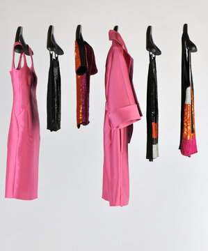Elegant and trendy women's clothes hanging