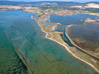 Aerial view of the lagoons and flaming habitat in the Camargue in the south of France - obrazy, fototapety, plakaty