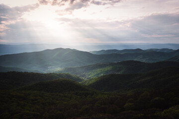 Fototapeta na wymiar Afternoon crepuscular rays filling the valleys of Shenandoah National Park in the Summer.