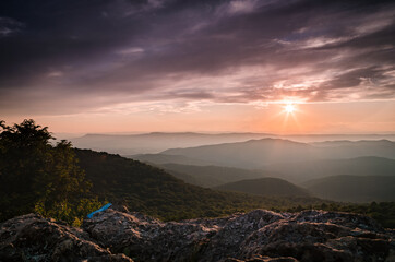 A gorgeous scene of Shenandoah National Park at sunset from Bearfence Mountain during the Summer.