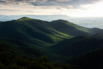 Sunlight illuminating the slopes of a mountain in Shenandoah National Park during the late afternoon viewed from Blackrock Summit.