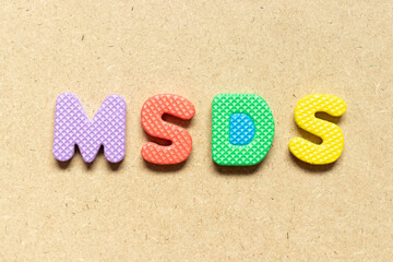 Foam alphabet letter in word MSDS (Abbreviation of material safety data sheet) on wood background