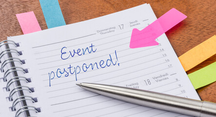 Daily planner with the entry Event postponed