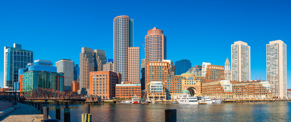 Panoramic Boston City Skyline and Seascape at the Boston Harbor. Clear Blue Sky Backgrounds.