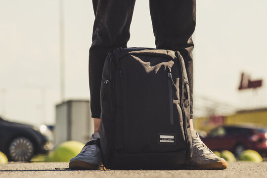person walking on the street with a backpack