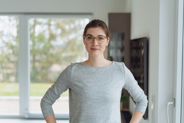 Attentive astute young woman staring at the camera