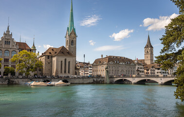 Panoramic view of historic Zurich city center with famous Fraumunster and Grossmunster Churches and...