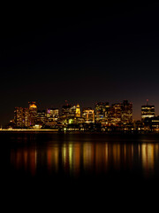 Fototapeta na wymiar Boston Dark Night Skyline and Sea Reflections over the Mystic River