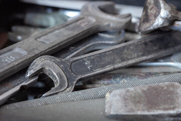 A box of old, worn locksmiths ' tools.