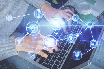 Double exposure of woman hands typing on computer and social network theme hologram drawing. People media concept.