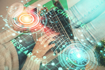 Double exposure of woman hands working on computer and data theme hologram drawing. Tech concept.