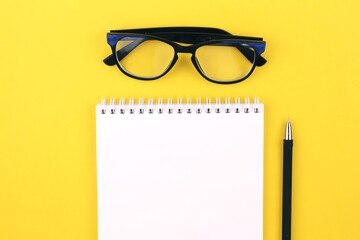 glasses and notebook