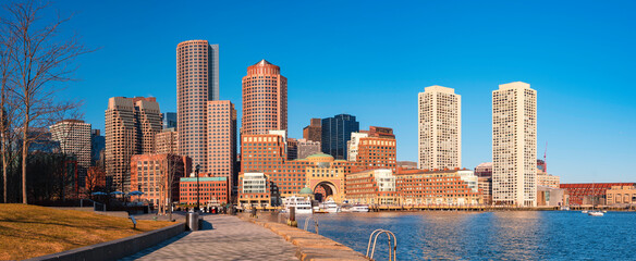 Panoramic Boston City Skyline and Seascape at the Boston Harbor. Clear Blue Sky Backgrounds.