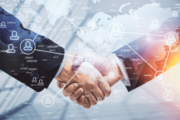 Double exposure of social network theme hologram and handshake of two men.