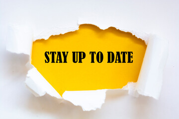 STAY UP TO DATE word written under torn paper.