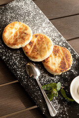 Breakfast cheesecakes in cafe. Copy space.