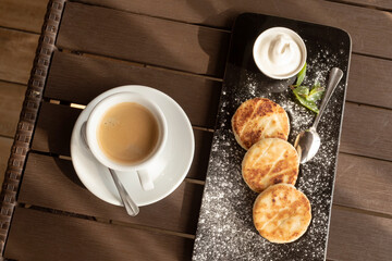 Breakfast cheesecakes in cafe. Copy space. Coffee and Cake.