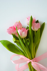 a bouquet of pink tulips. beautiful spring flowers. background for decoration for the Easter holiday.