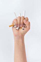 Quit smoking, human hands breaking the cigarette