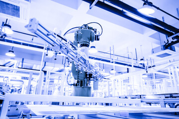 Industrial robots automate arms, and modern factories produce photovoltaic panels on assembly lines. 4.0 in industry. Internet intelligent factory.