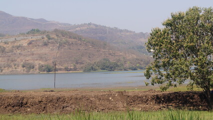 Naklejka premium Lake and farmlands in Pune, India
