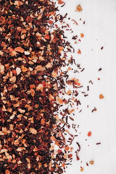 Dry fruit tea randomly scattered on a white table background. Top view. Copy, empty space for text