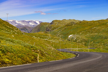 Road with poles in mountains