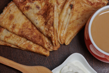 photo pancakes yogurt a cup of coffee on a blackboard