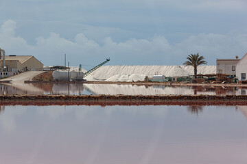 Scenic view of old salt factory and mirror-like salt pool in regional reserve of las Salinas y Arenales de San Pedro del Pinatar, Murcia, Spain