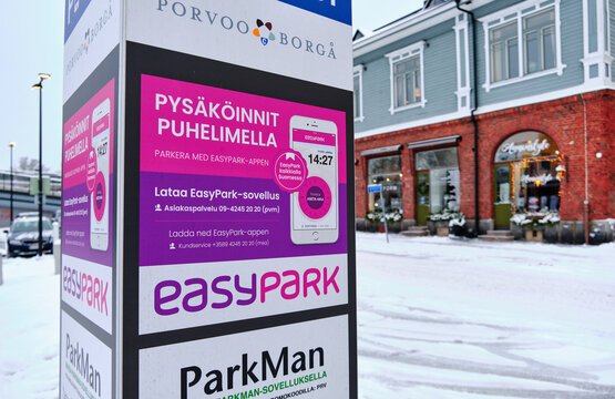 Porvoo, Finland - January 3, 2021: Parking information signboard about payment rules. EasyPark and ParkMan the most popular parking payment services in Finland.