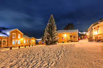 Christmas tree on the Market Square in Old Porvoo in winter snowy night, Finland.