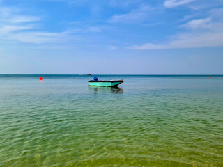 The sea, the horizon and the small fishing boats