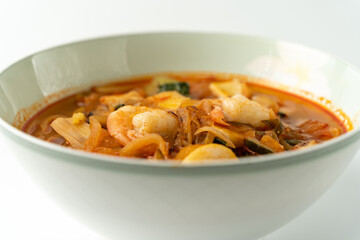 Spicy Korean-style noodle with vegetables and seafood.