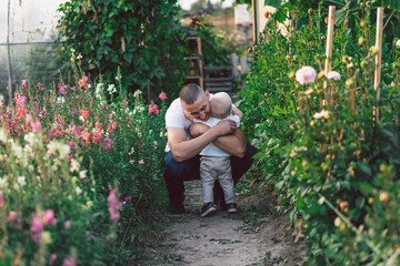 Father and his son playing and hugging in outdoors. Concept of Father's day