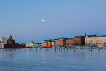 Finland, Helsinki, March 3, 2021.     Dawn, Spring panorama of Helsinki, view of the Katajanokka and Krununhakka districts in the foreground the Gulf of Finland