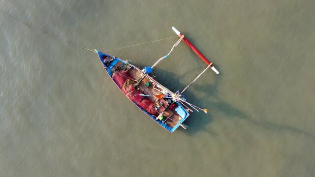 Fishing boat anchored off Ladghar beach at Dapoli, located 200 kms from Pune on the West Coast of Maharashtra India.