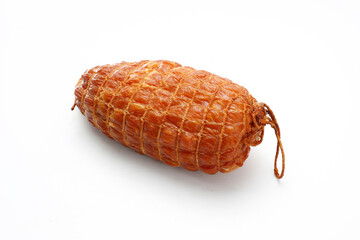 Small, natural, smoked ham in one piece, in netting, isolated on a white background. Homemade, smoked cold cuts. Traditional meat product, a packshot photo for package design, template.