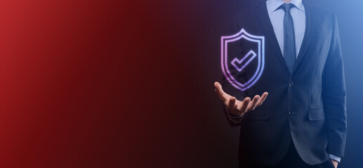 Protection network security computer in the hands of a businessman. business, technology, cyber security and internet concept - businessman pressing shield button on virtual screens Data protection