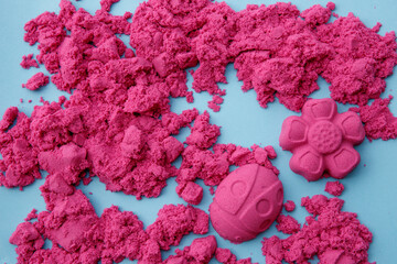 children's kinetic sand on a blue background