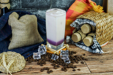 Iced Milkshake Taro is combined taro powder, milk, brewed tea, ice, and creamer. taste is sweetness, smooth, an creamy so is perfect drink on tropical area