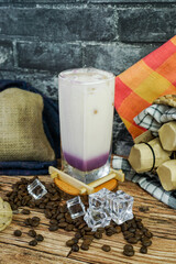 Iced Milkshake Taro is combined taro powder, milk, brewed tea, ice, and creamer. taste is sweetness, smooth, an creamy so is perfect drink on tropical area