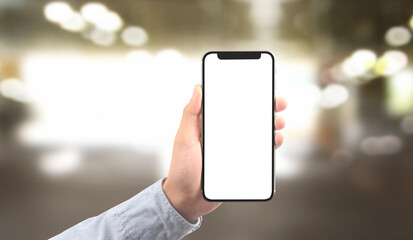 Hand holding smartphone device touching screen