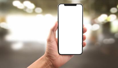 Hand holding smartphone device touching screen