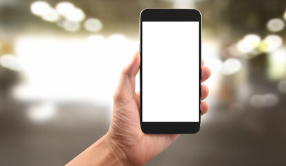 Hand holding smartphone device touching screen