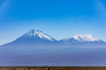 Fototapeta premium Volcanoes in the Atacama, Chile on a cloudless winter day