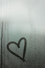 heart painted on a misted window
