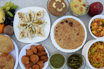 Indian fasting buffet platter. Many homemade dishes like Rajgira sheera, sweetpotato halwa, dhokla, patatha, chutney