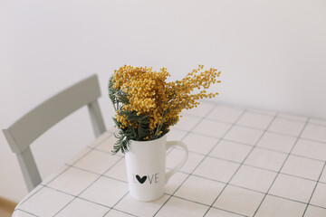 Mimosa in a vase on the table